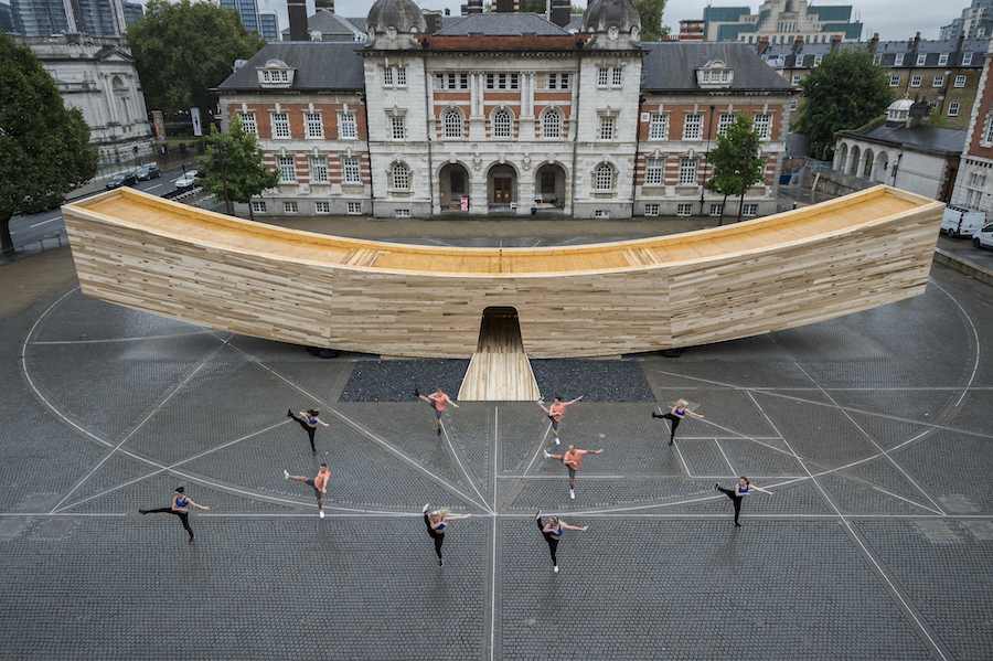 Dancers from the RMC Dance Company perform at teh opening - The Smile, a landmark project for the London Design Festival designed by architect Alison Brooks and the engineer was ARUP. It will be on show outside the Chelsea College of art from 17 September – 12 October. Measuring 34m in length, the curved form is a ‘bold and exciting’ experiment in wood engineering and in design being made from cross-laminated timber (CLT) in tulipwood, it has been initiated by The American Hardwood Export Council (AHEC).